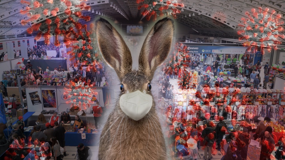 Foto einer Gaming-Convention, darübergelegt sind Covid-Viren und ein in die Kamera schauender Hase mit FFP2-Maske